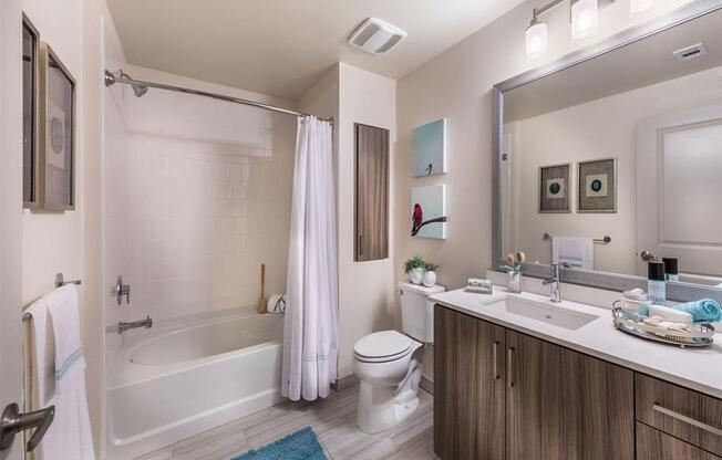 a bathroom with a toilet sink and bathtub