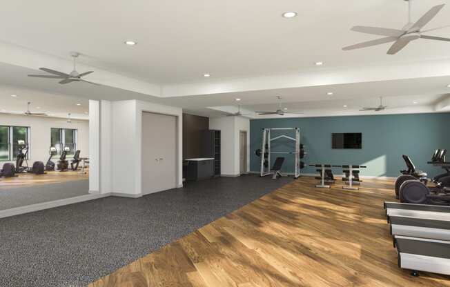 Studios, One, Two, and Three-BR Apartments in Chattanooga, TN - Populus Waterside - State-of-the-art Fitness Center with Weights, Cardio Equipment, Large Mirror, Ceiling Fans, Large Windows, and TV