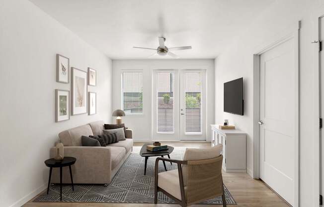 A living room with a couch, chair, and television.
