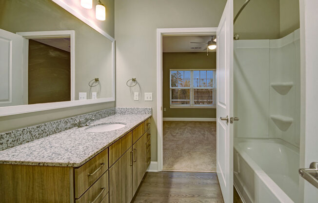 Bathroom with tub, sink, and toilet at York Woods at Lake Murray Apartment Homes, Columbia, SC, 29212