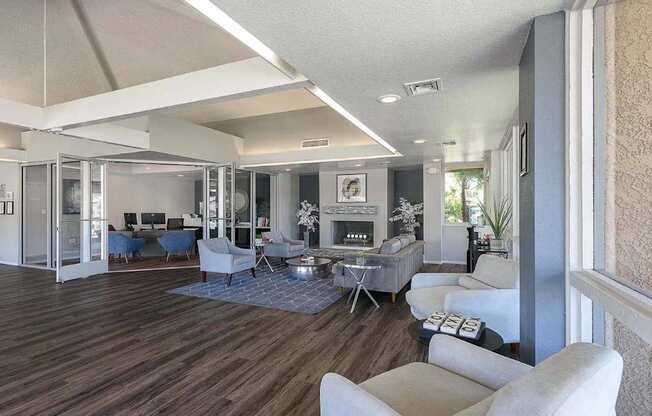 A living room with a fireplace and a dining table.