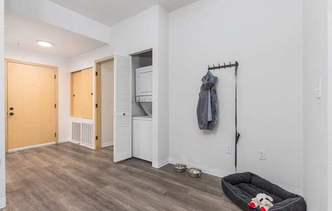 a living room with a couch and a door to a closet  at Shoreline Village, Washington