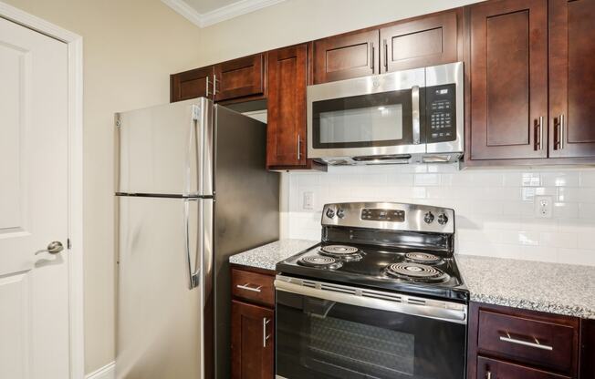 a kitchen with a stove microwave and refrigerator