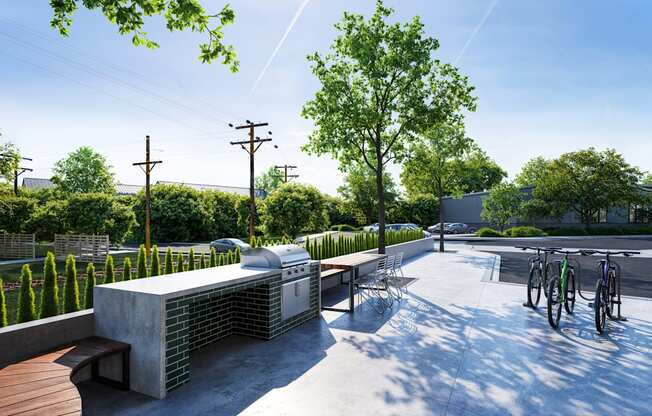 a seating area with benches and a barbecue grill on a city street at Link Apartments® CYKEL Apartments, North Carolina