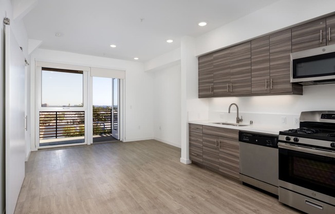 a kitchen with stainless steel appliances and wooden cabinets