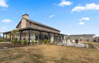 a large house with a yard and a patio