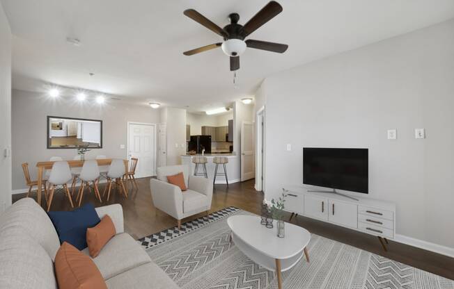 a living room with a couch and a tv at MetroPlace at Town Center, Maryland