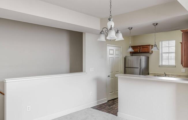 a kitchen with a sink and a mirror
