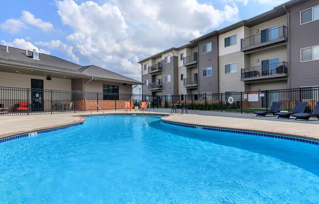 SOAK UP THE SUN AT OUR SHIMMERING SWIMMING POOL AT THE SUMMIT AT SUNNYBROOK VILLAGE