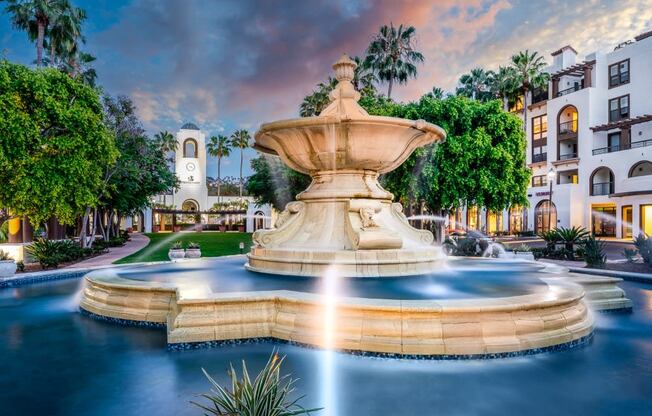 water fountain at sunset