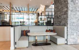 a seating area with two couches and a table  at Century West Pryor, Lee's Summit, MO