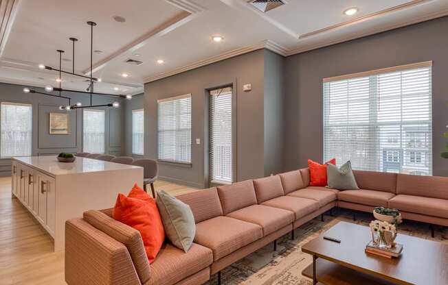 a living room with a couch and a table at The Bella at Westchester, Midlothian, VA