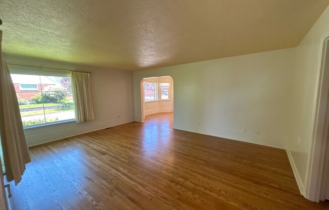 Model three bedroom home, with well-maintained yard & attached garage!