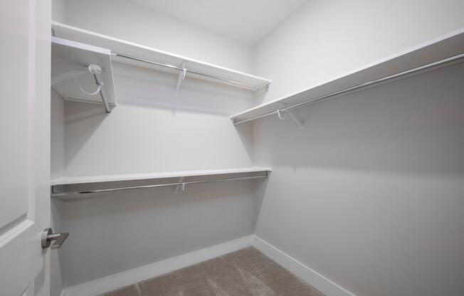 a spacious walk in closet in a 555 waverly unit