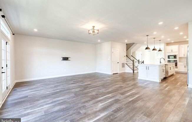 Welcome to this nearly new, 3bd 3.5bth end-unit home!