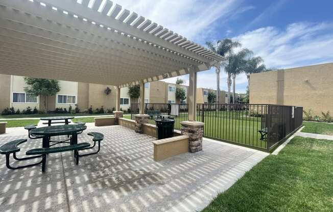 Dog Park and Outdoor Shaded Seating at Whiffle Tree Apartment homes in Huntington Beach, CA.