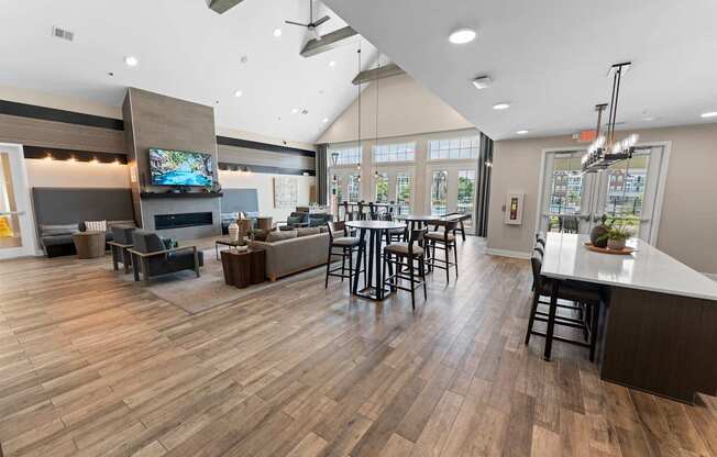 A modern open plan living and dining area with a bar.