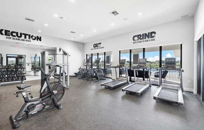 the gym with cardio equipment at the apartments