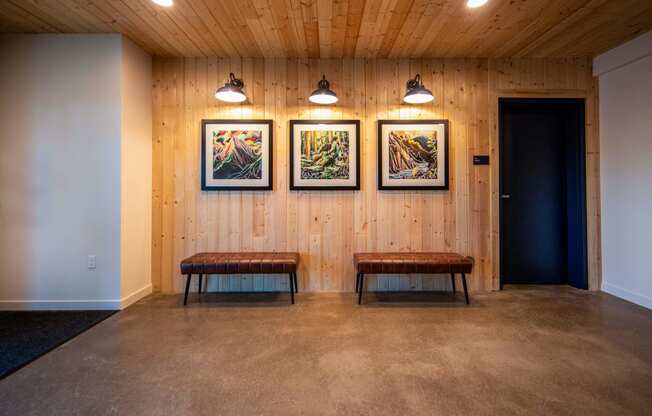 a room with two benches and three paintings on the wallat Scouter's Mountain, Oregon