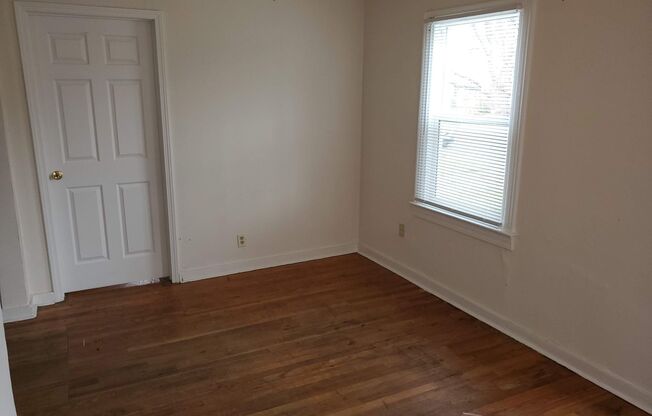 2 bd, 1 ba house, hardwoods, new paint, fenced with shed, w/d included, mowing provided, north central location near Business Loop