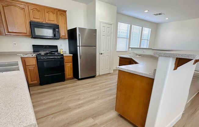 4 bed 2.5 bath home in the southwest with 3 bedrooms downstairs and the master bedroom upstairs! New LVP flooring installed throughout the house!