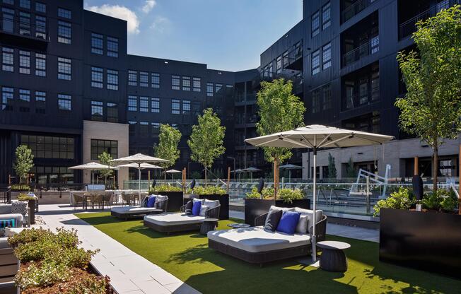 A welcoming outdoor courtyard with grilling spaces designed for shared meals and relaxed gatherings.