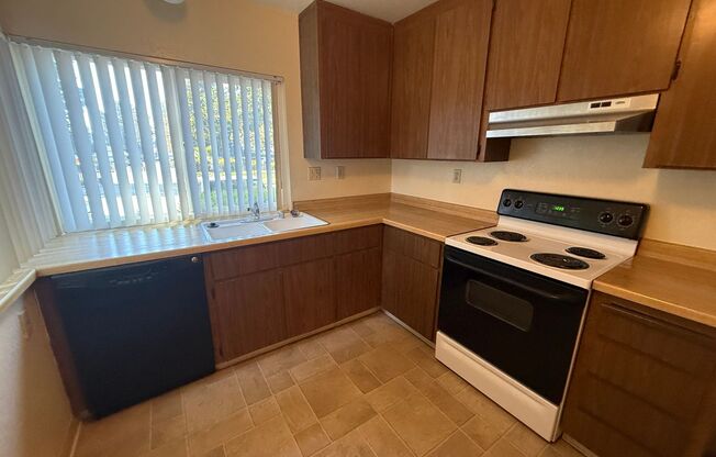 Spacious 2bd First Floor Condo W/Private Patio, Attached Garage, & Private Laundry Room