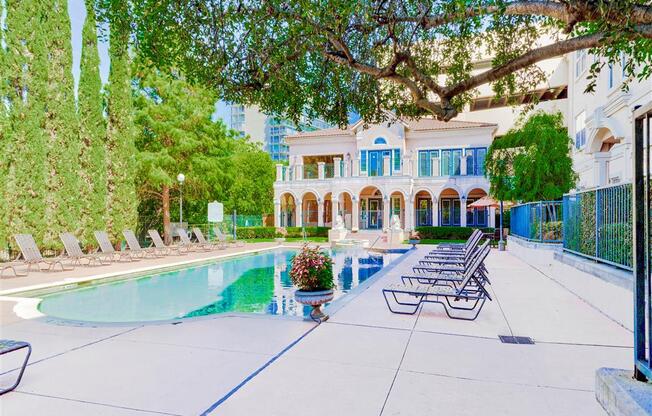 Gated pool and sundeck at The Villas at Katy Trail in Uptown Dallas, TX, For Rent. Now leasing Studio, 1, 2 and 3 bedroom apartments.