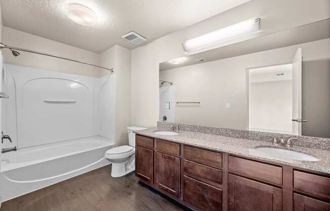 a bathroom with a toilet sink and bathtub