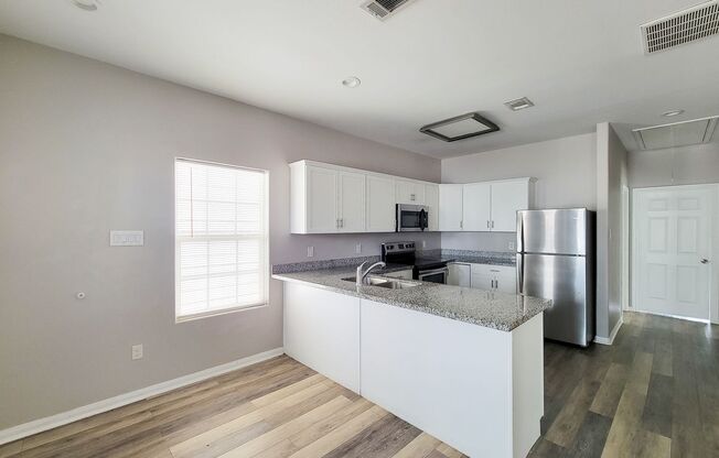 Beautiful 1 Story MOVE IN READY New Construction home in Lake Conroe Village Subdivision. This Gorgeous Open Floor Plan has 2 Bedrooms, 2 Baths. Front door with Glass Insert. Large Kitchen area with Granite counter tops and ample Kitchen Cabinets with S/S