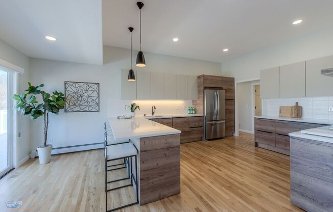 Breathtaking Waneka Lake Ranch with Mountain Views, Designer Finishes & Walk-Out Lower Level
