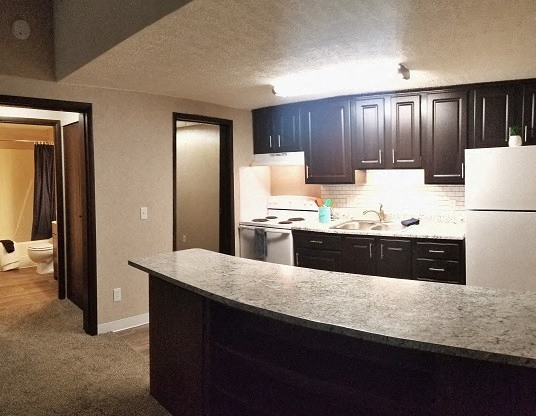 a kitchen with a granite counter top