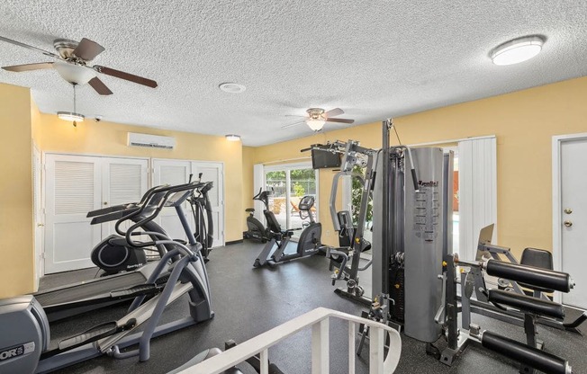 Woodland Hills Apartments - Fitness Room Featuring Various Cardio and Weight Equipment