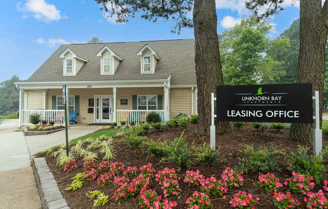 a building with a leasing office sign in front of it at Linkhorn Bay Apartments, Virginia Beach, VA