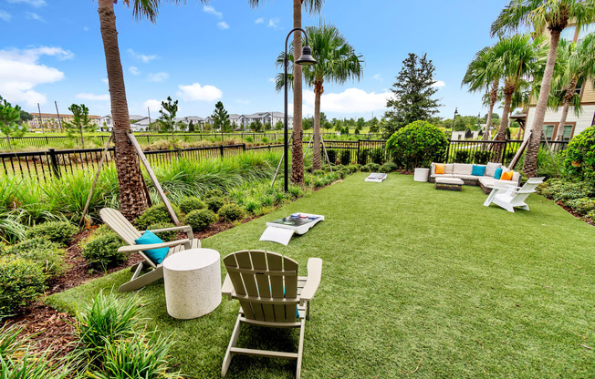 a backyard with lawn chairs and hammocks