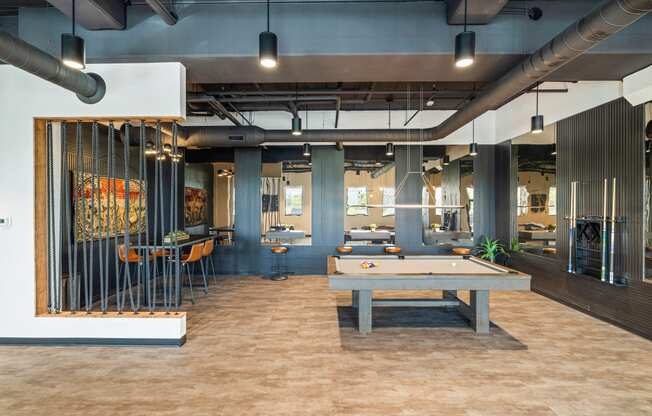 a game room with a pool table and tables at EagleRidge Plaza Residences, North Dakota, 58104