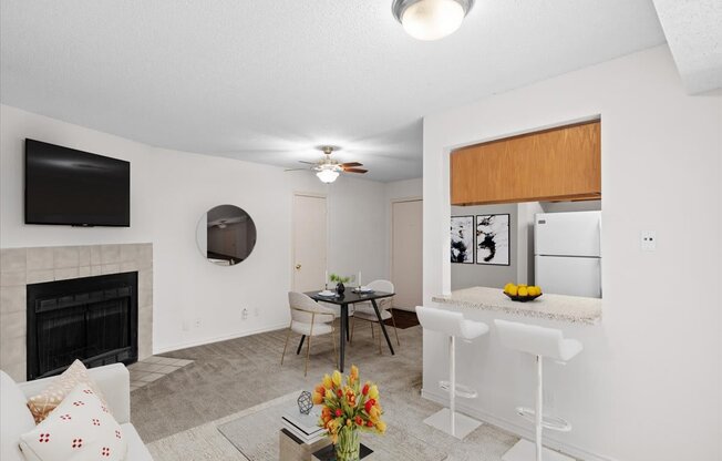 a living room with a kitchen and a dining room