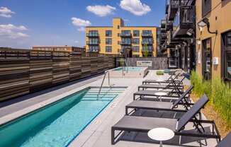 a view of the rooftop pool and hot tub