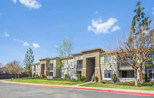 a row of apartment buildings on a street corner