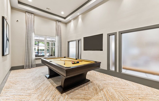 Langley Pointe Apartments | Billiards Room w/ View of the Pool