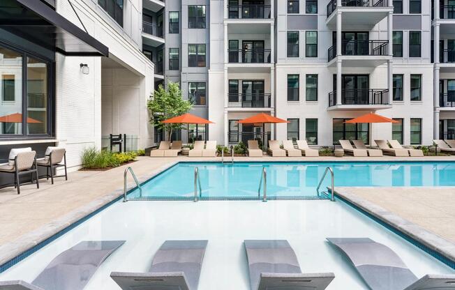 Sunbathe in the resort-style pool’s tanning ledge or lounge poolside under vibrant umbrellas—your retreat is just steps from home.