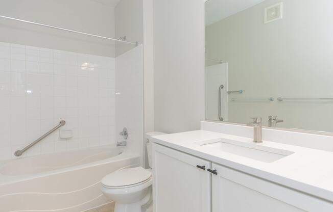 a room with a sink and a mirror