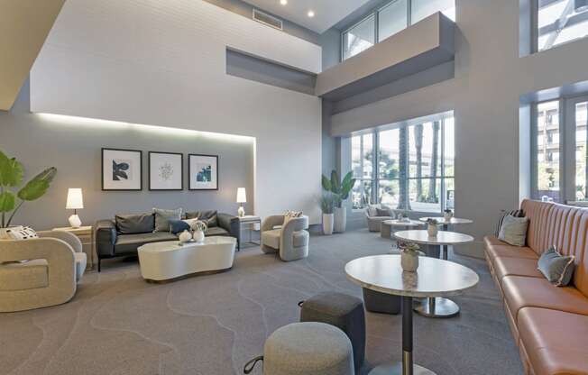 a large living room with couches and tables  at Vue, San Pedro, 90731