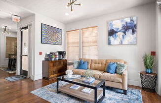 a living room with a couch and a coffee table