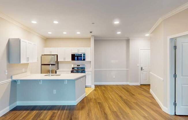 A kitchen with a sink and cabinets.