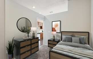 a bedroom with a bed and a dresser with a mirror