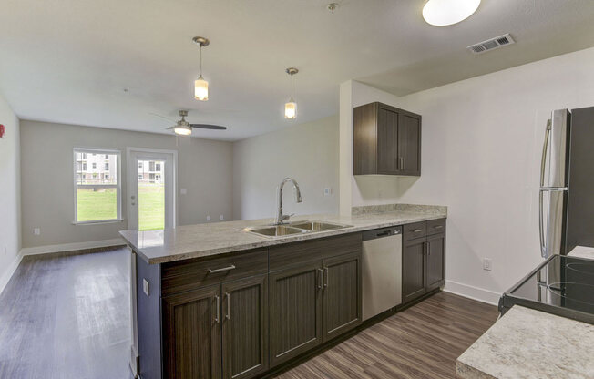 Kitchen with Breakfast Bar at Chase Creek Apartment Homes, Huntsville, AL, 35811