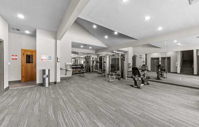 A gym with a variety of equipment is shown.