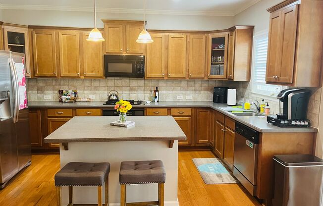 Beautiful townhome! 1 car garage, sunroom, glass shower, soaking tub, large room, kitchen w/island!