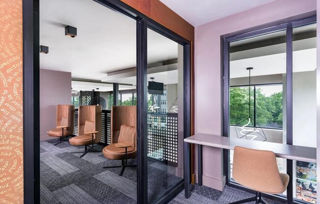 Coworking spaces with comfortable seating areas and private workstations.